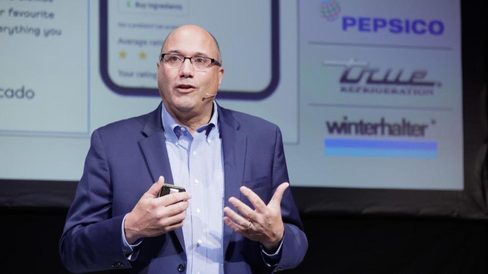 Lou Cooperhouse presenting at an industry event